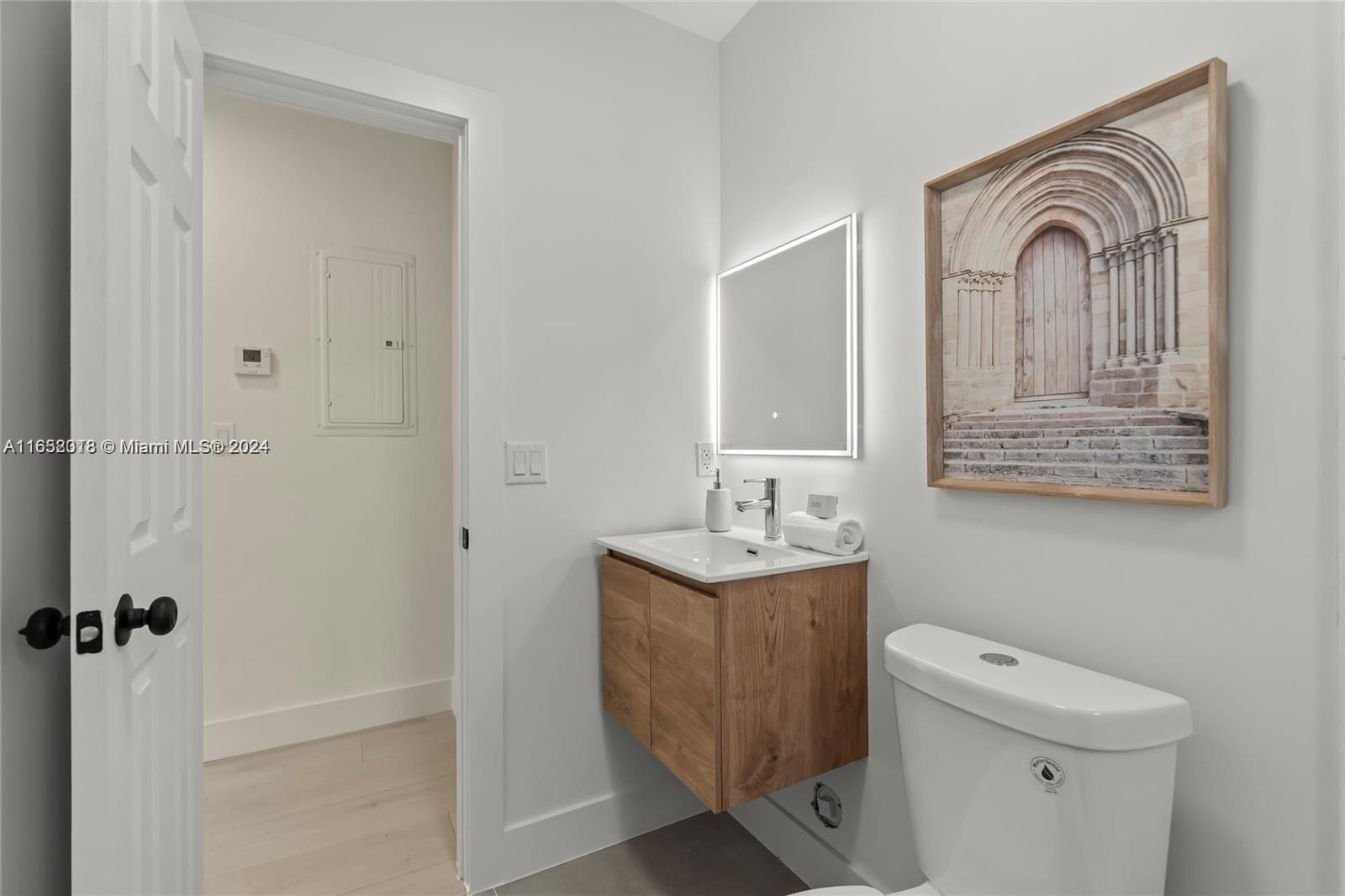 151 Northwest 146th Street Miami, FL 33168 - Photo 25 of 35 a view of bathroom with a toilet sink and mirror