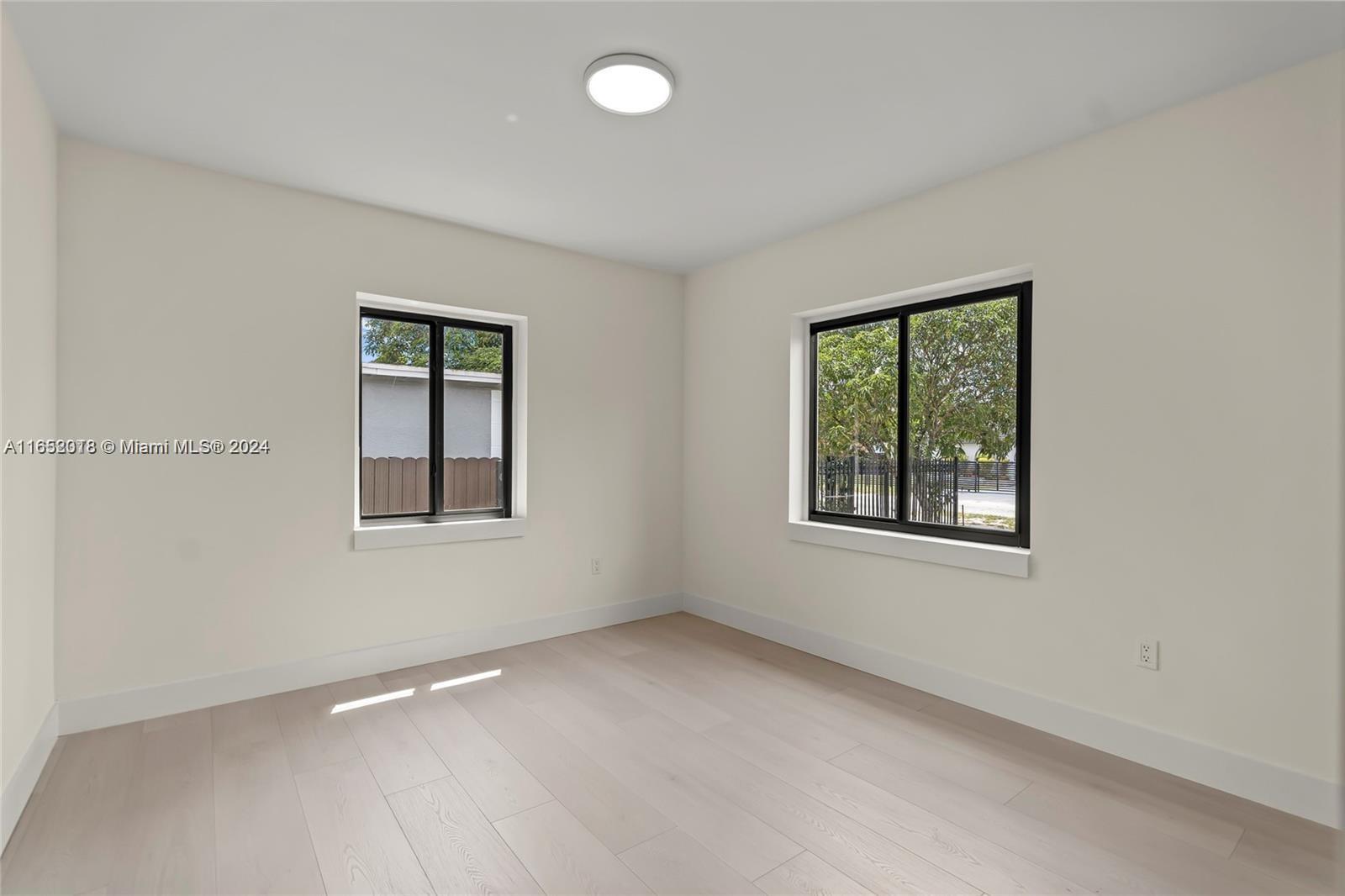 151 Northwest 146th Street Miami, FL 33168 - Photo 26 of 35 an empty room with windows
