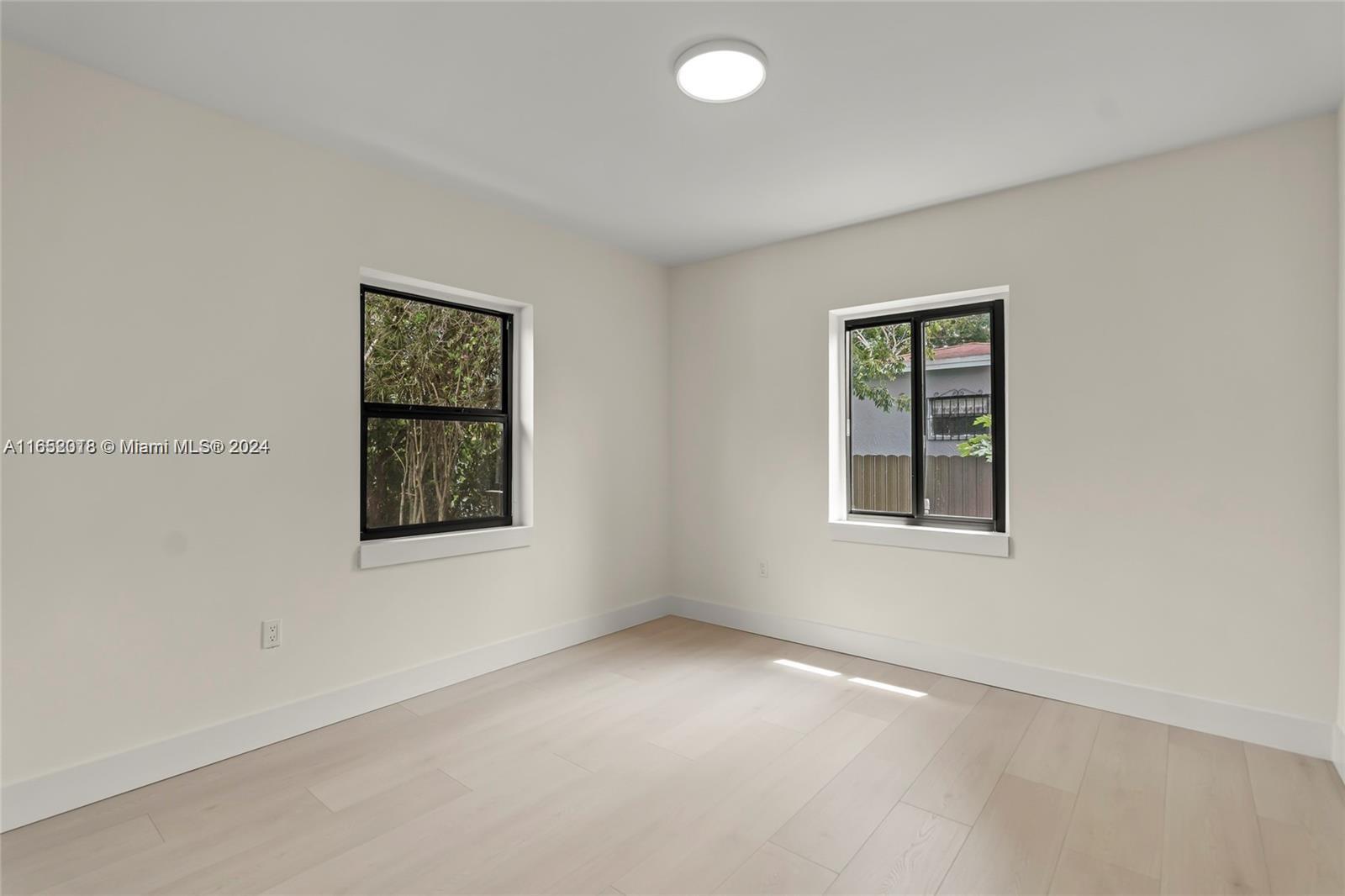 151 Northwest 146th Street Miami, FL 33168 - Photo 28 of 35 an empty room with windows
