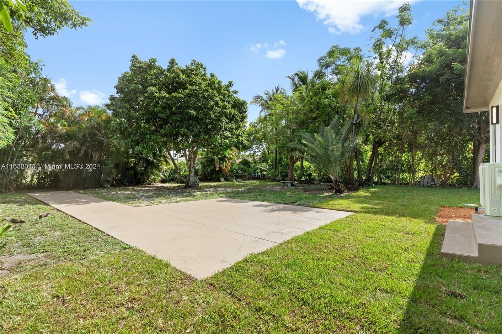 151 Northwest 146th Street Miami, FL 33168 - Photo 30 of 35 a view of backyard with green space