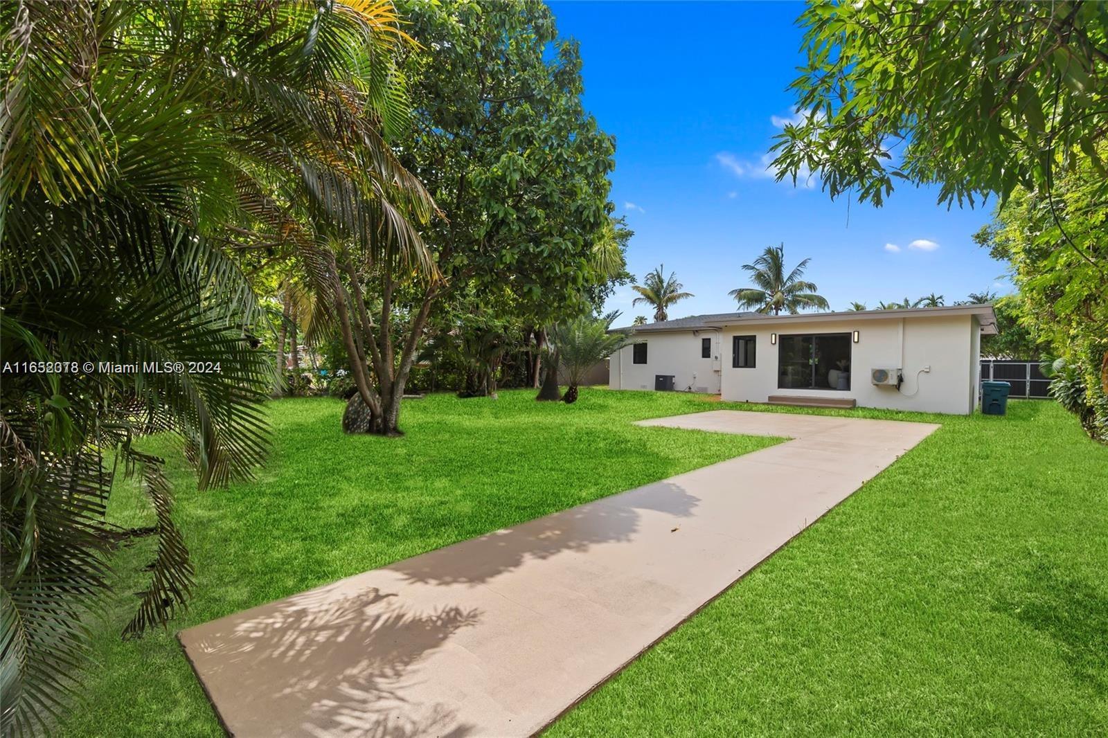 151 Northwest 146th Street Miami, FL 33168 - Photo 31 of 35 a front view of a house with a yard