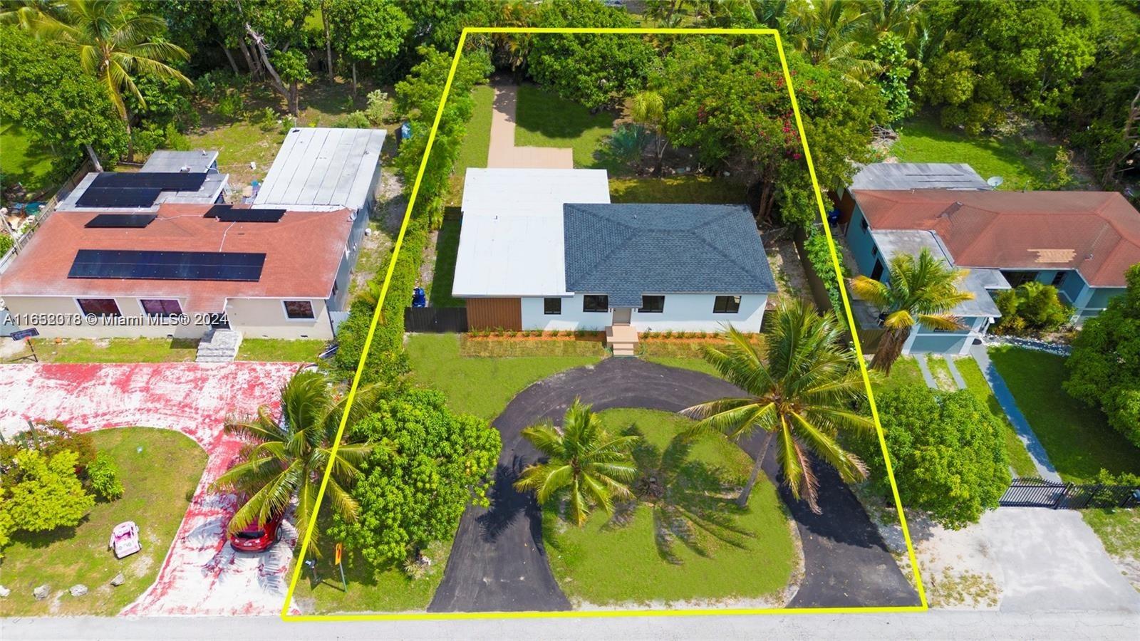 151 Northwest 146th Street Miami, FL 33168 - Photo 33 of 35 an aerial view of multiple houses with yard
