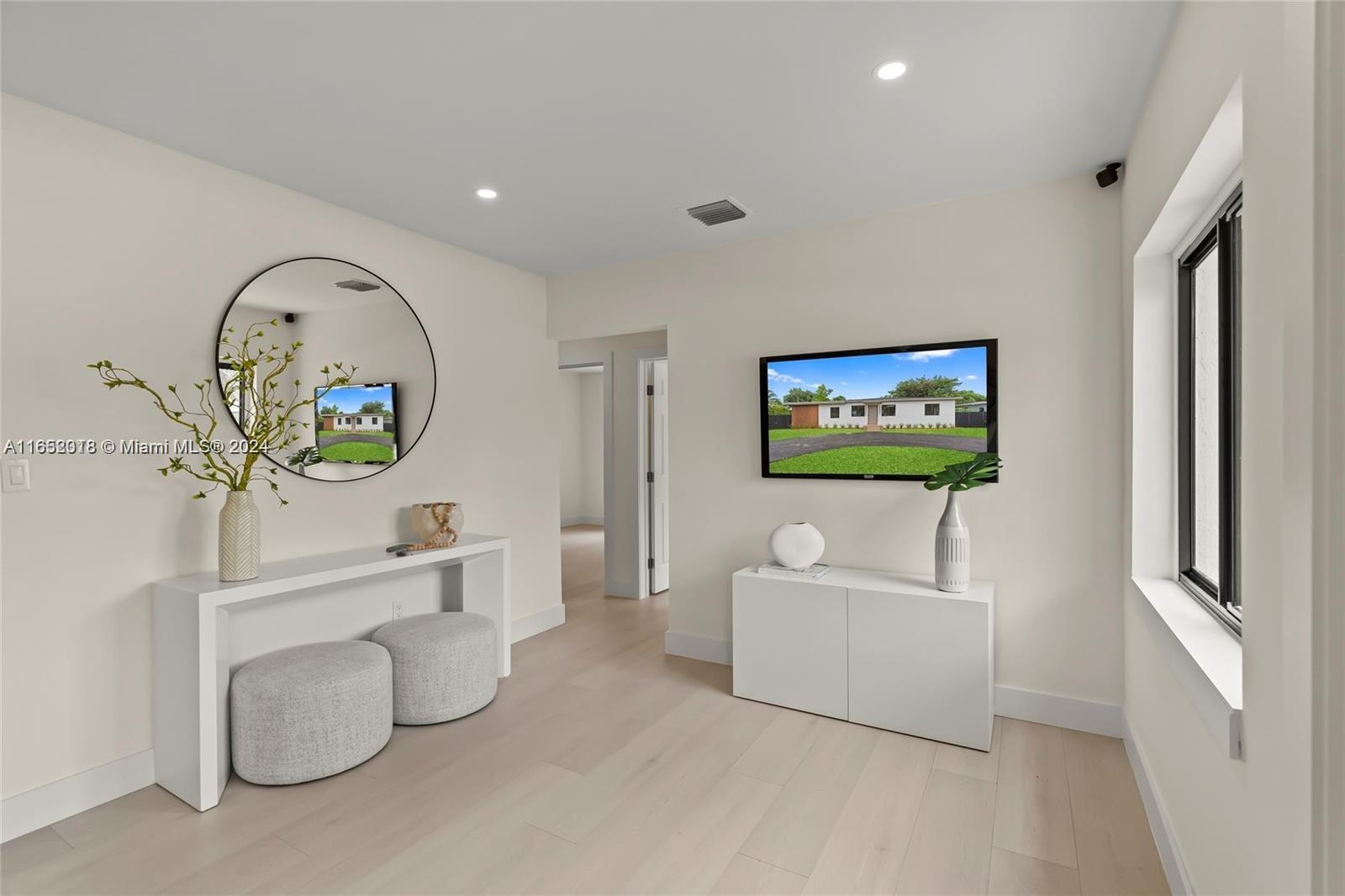 151 Northwest 146th Street Miami, FL 33168 - Photo 5 of 35 a living room with furniture and a window