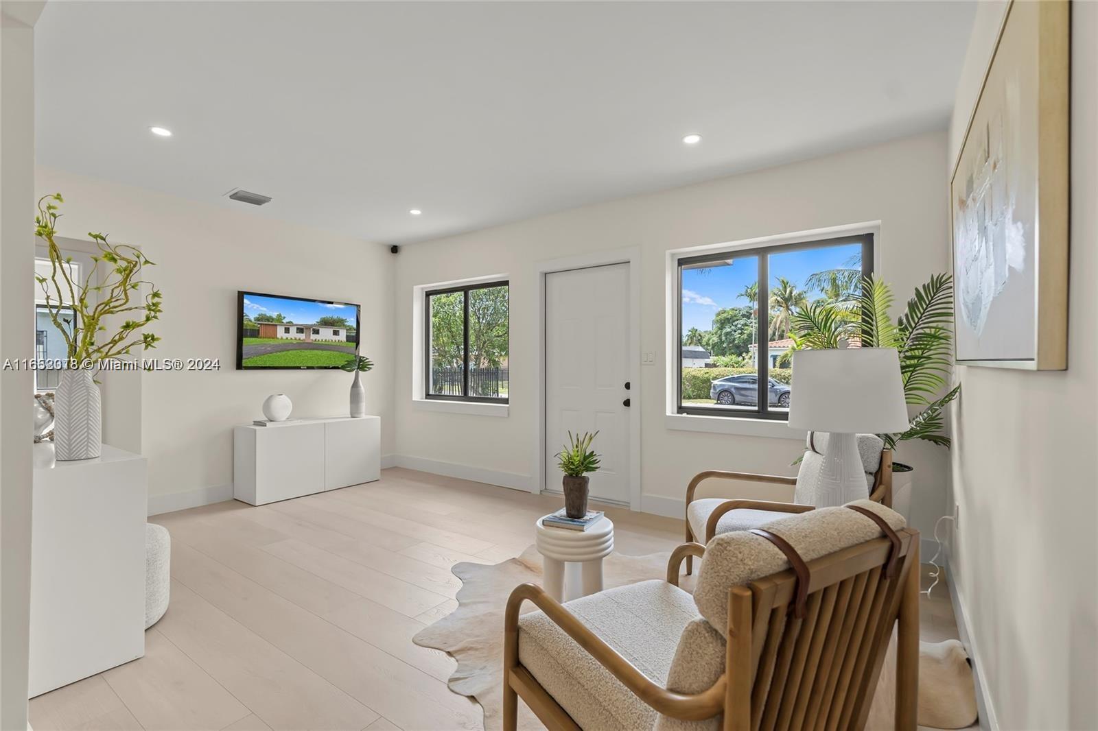 151 Northwest 146th Street Miami, FL 33168 - Photo 6 of 35 a living room with furniture and a window