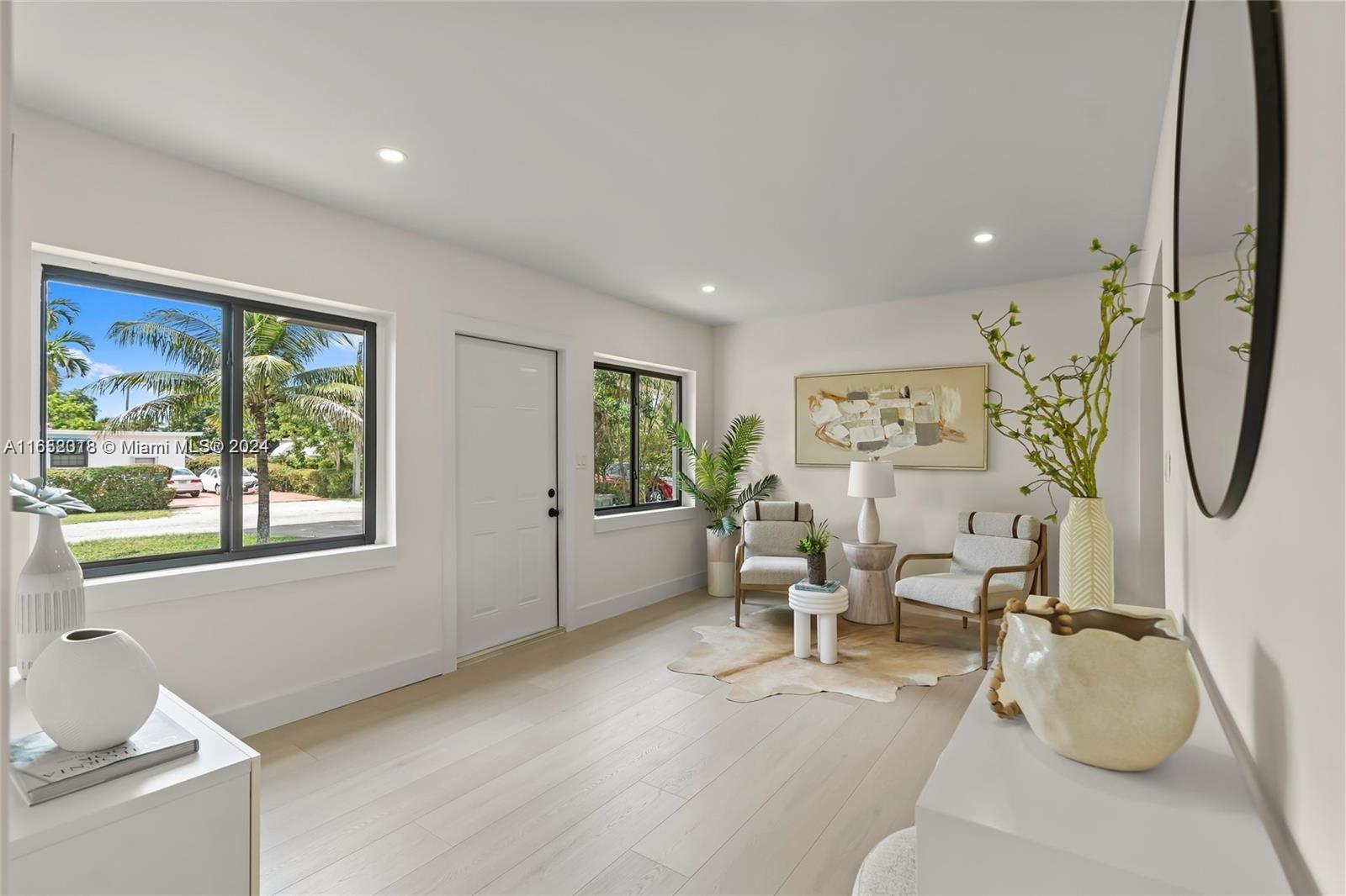 151 Northwest 146th Street Miami, FL 33168 - Photo 7 of 35 a living room with furniture and a large window