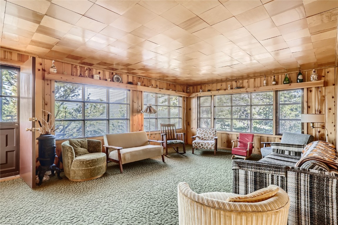 453 Rd P69 Bailey, CO 80421 - Photo 2 of 11 a living room with furniture and a floor to ceiling window