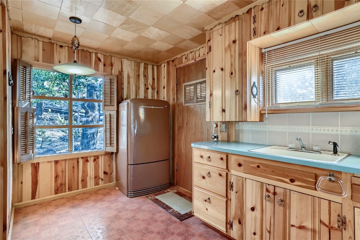 453 Rd P69 Bailey, CO 80421 - Photo 5 of 11 a kitchen with stainless steel appliances granite countertop a refrigerator and a sink