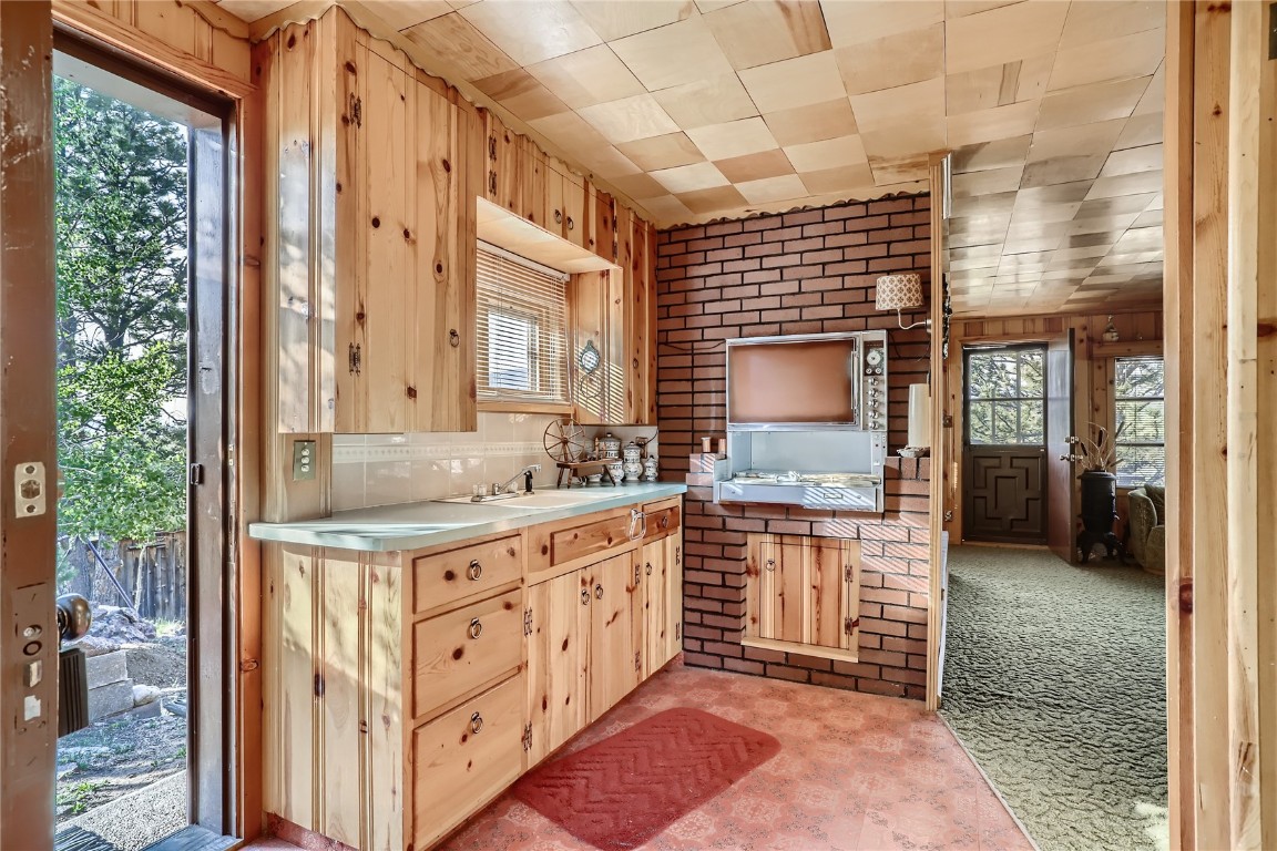 453 Rd P69 Bailey, CO 80421 - Photo 6 of 11 a bathroom with a sink a mirror and a shower