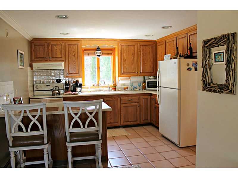 74 Greylock Road Bristol, RI 02809 - Photo 5 of 16 Exterior Front. Corian counter tops. New Refrigerator.