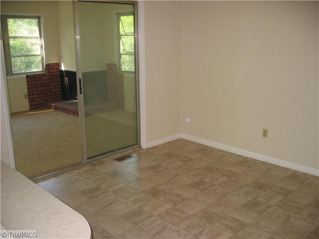 1060 Linger Road Winston-Salem, NC 27127 - Photo 11 of 16 Sunroom. View into sunroom from dining