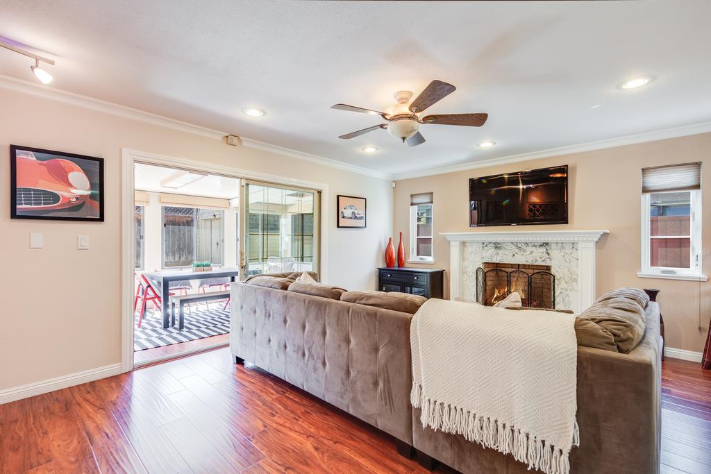 3129 Bilbo Drive San Jose, CA 95121 - Photo 13 of 34 a living room with fireplace furniture and a flat screen tv