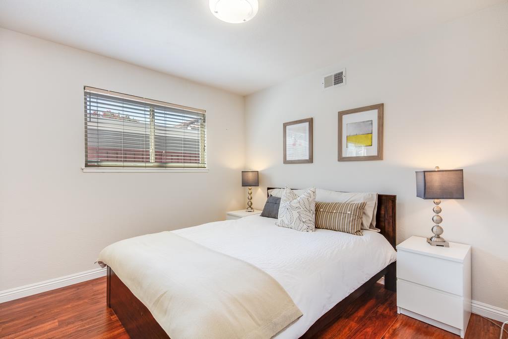 3129 Bilbo Drive San Jose, CA 95121 - Photo 15 of 34 a bedroom with a bed and a night stand
