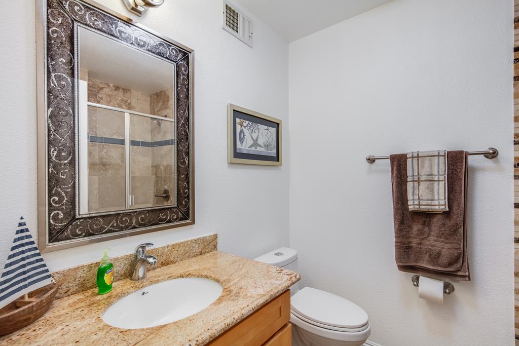 3129 Bilbo Drive San Jose, CA 95121 - Photo 16 of 34 a bathroom with a granite countertop toilet sink and mirror