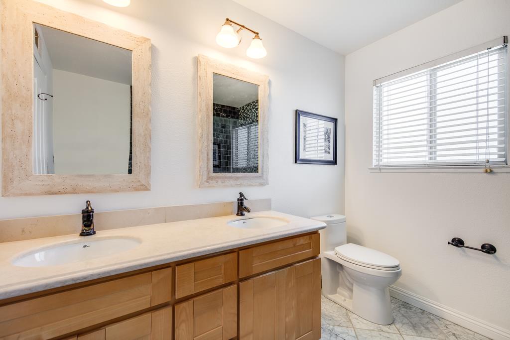 3129 Bilbo Drive San Jose, CA 95121 - Photo 26 of 34 a bathroom with a toilet sink and mirror