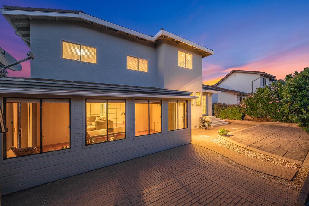 3129 Bilbo Drive San Jose, CA 95121 - Photo 34 of 34 a view of a house with large windows and a fireplace