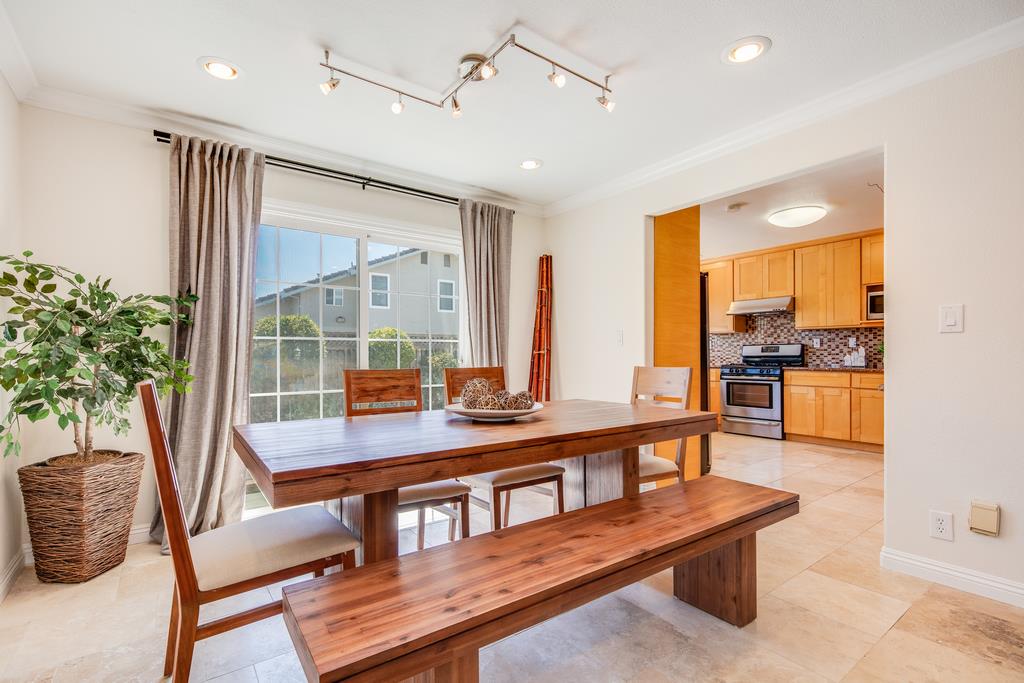 3129 Bilbo Drive San Jose, CA 95121 - Photo 5 of 34 a living room with furniture a large window and potted plants