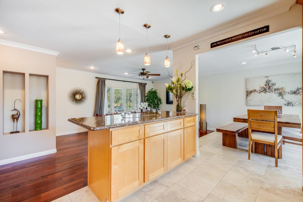 3129 Bilbo Drive San Jose, CA 95121 - Photo 8 of 34 a room with kitchen island stainless steel appliances furniture and a chandelier