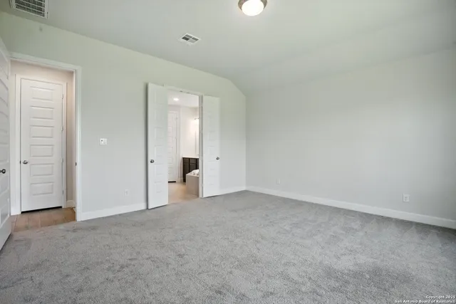 an empty room with closet area