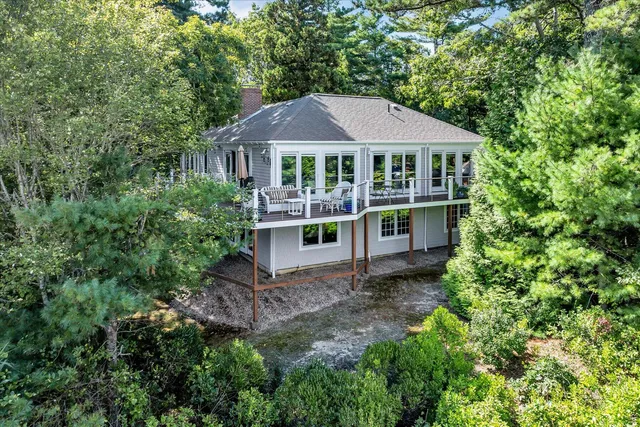 a view of a hallway with stairs and furniture