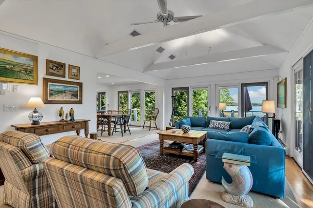 a view of a dining room with furniture window and outside view