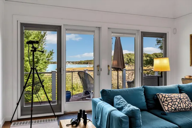 a kitchen with stainless steel appliances granite countertop a sink cabinets and wooden floor