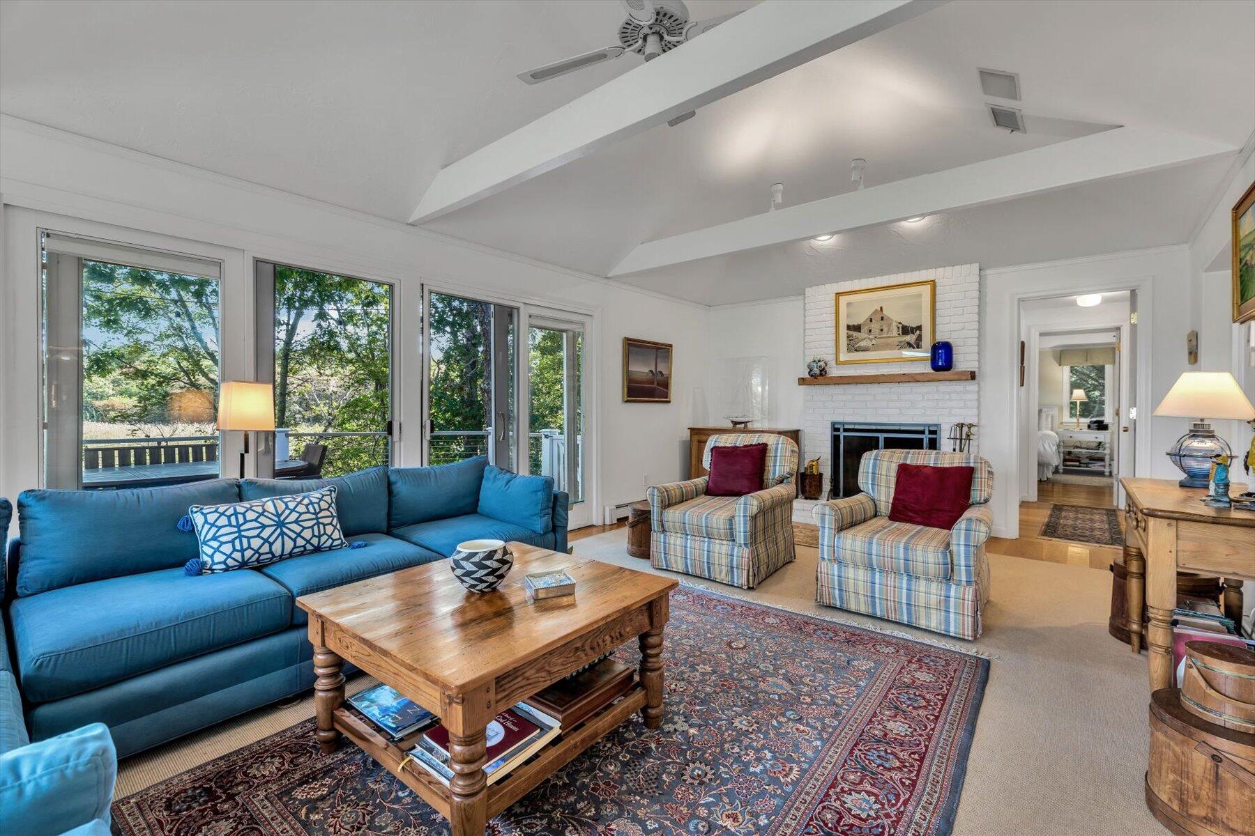 5 Tide Run Mashpee, MA 02649 - Photo 26 of 64 a living room with furniture large window and a table