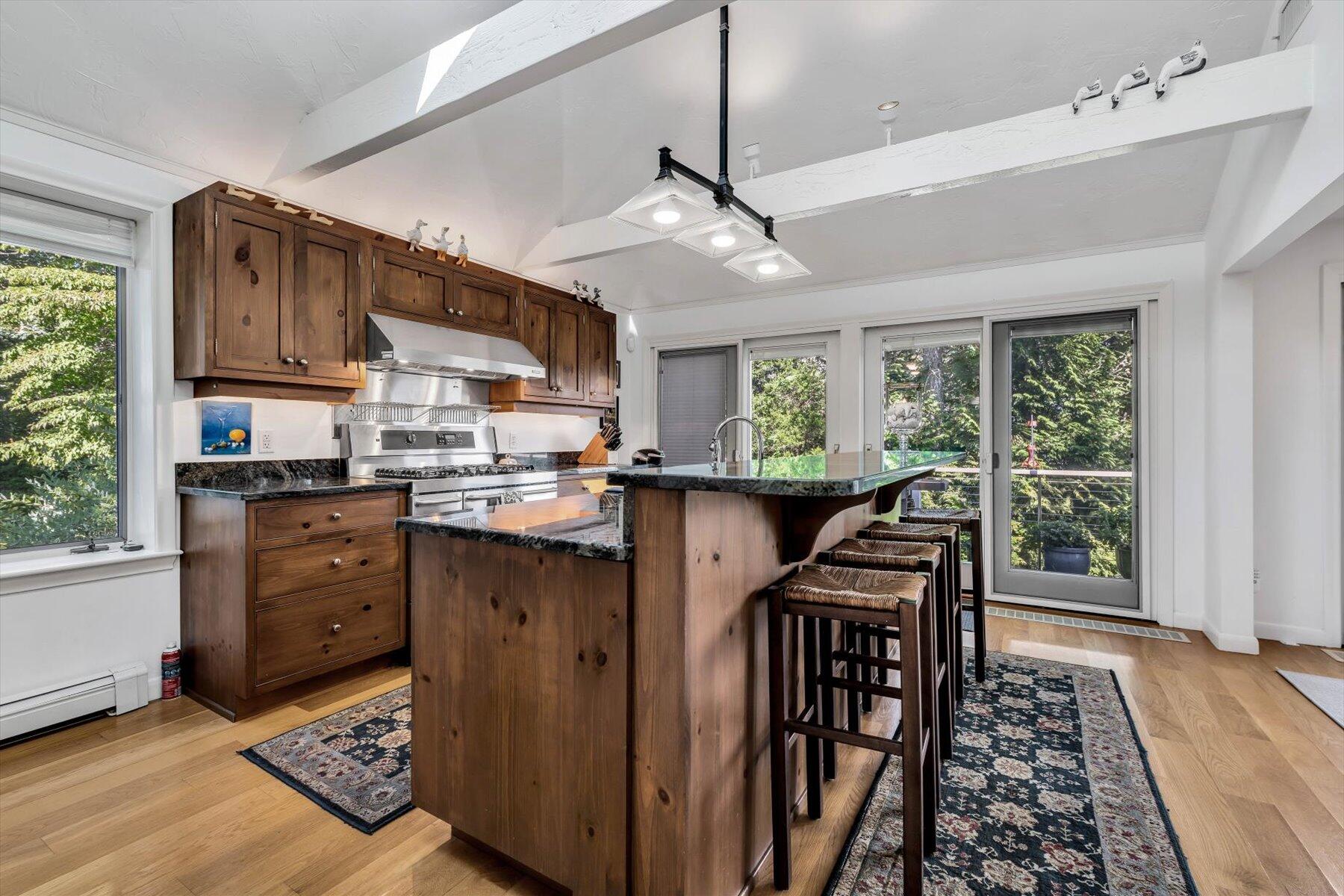 5 Tide Run Mashpee, MA 02649 - Photo 36 of 64 a kitchen with stainless steel appliances granite countertop a stove and a refrigerator