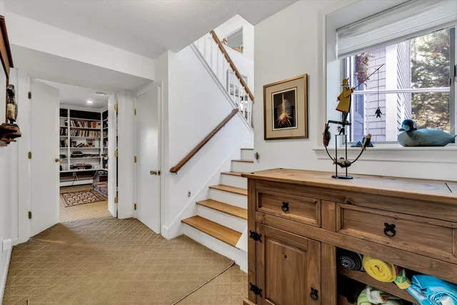 a bathroom with a toilet mirror and a sink