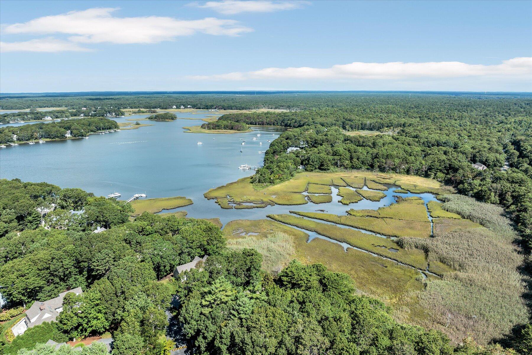 5 Tide Run Mashpee, MA 02649 - Photo 5 of 64 a view of a lake with a city