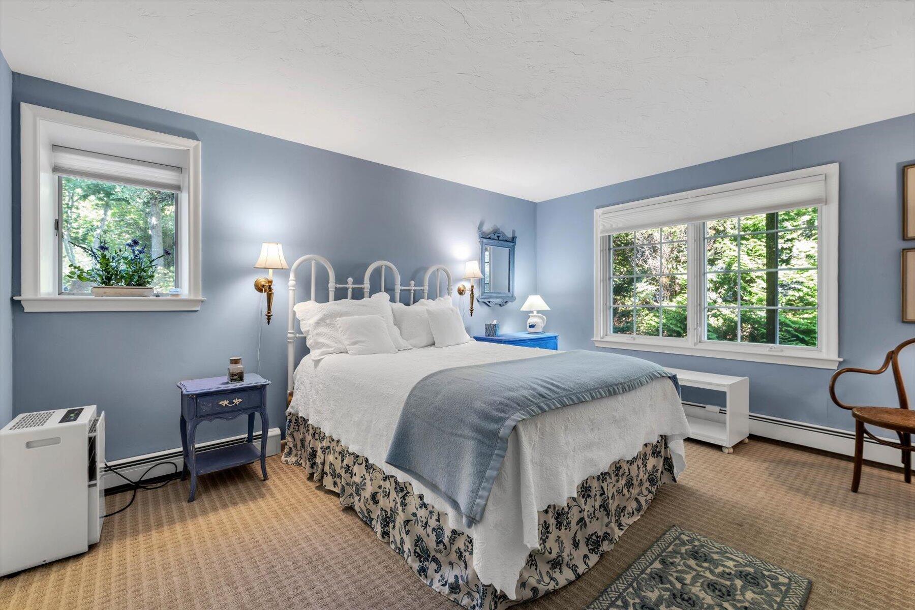 5 Tide Run Mashpee, MA 02649 - Photo 54 of 64 a bedroom with a bed wooden floor and a large window