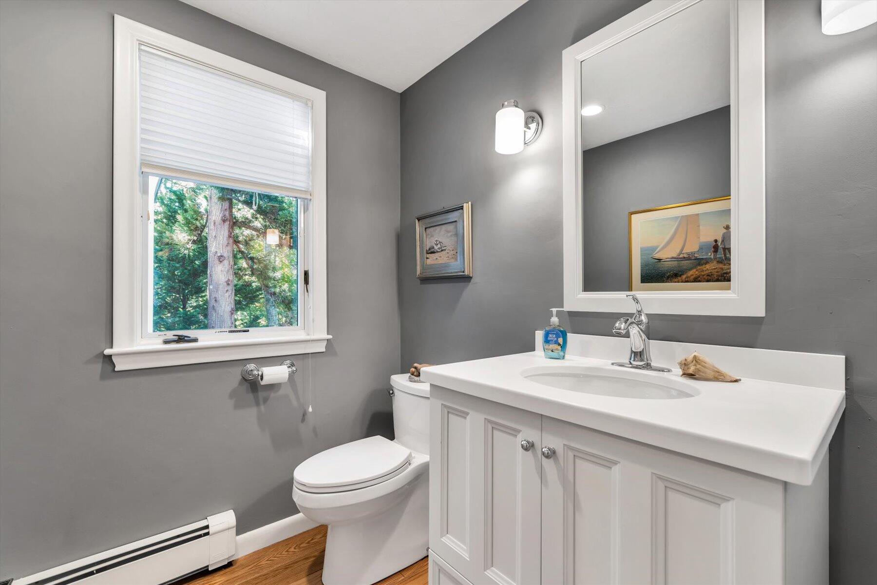 5 Tide Run Mashpee, MA 02649 - Photo 61 of 64 a bathroom with a sink a toilet and a mirror