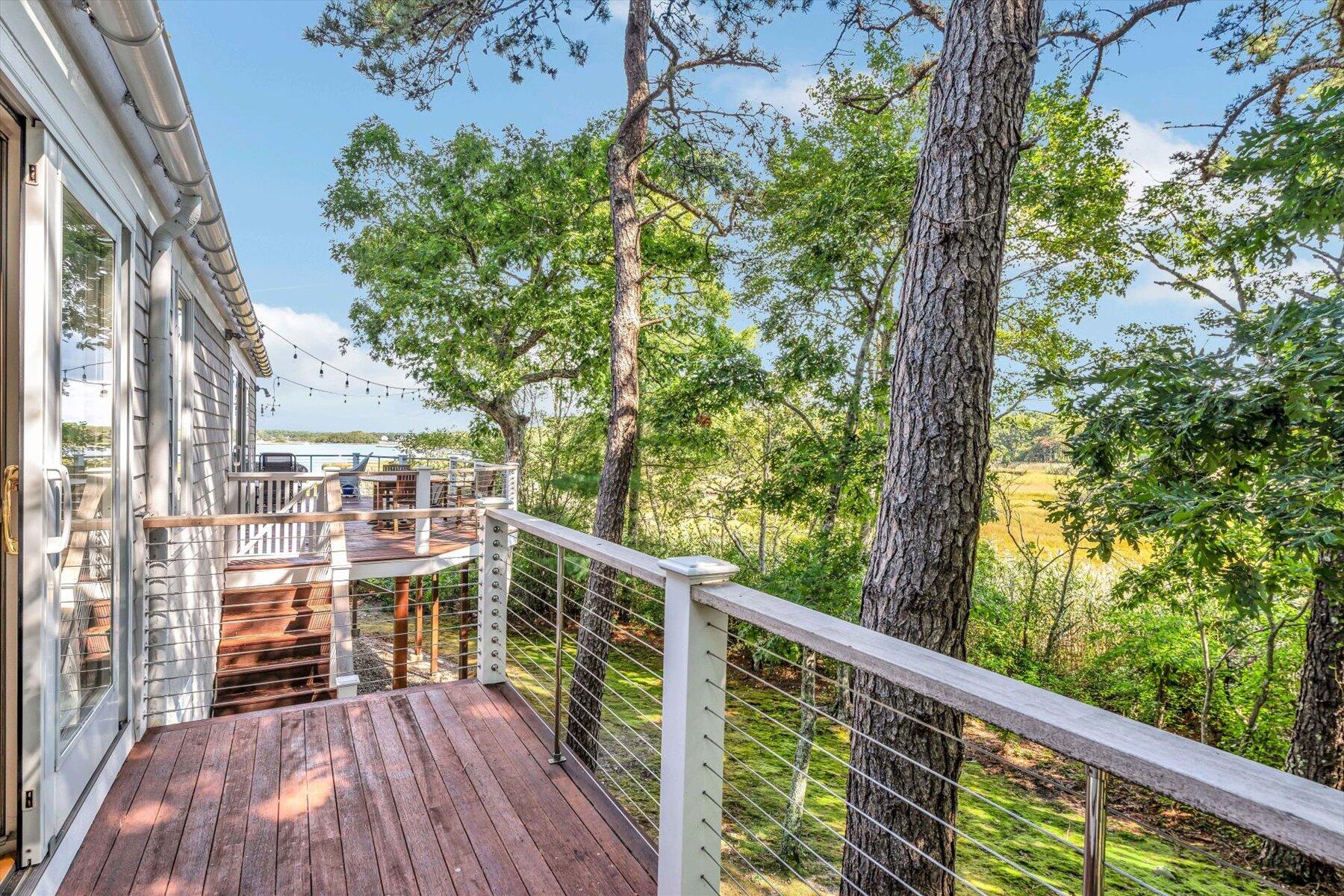 5 Tide Run Mashpee, MA 02649 - Photo 7 of 64 a view of balcony with wooden floor and fence