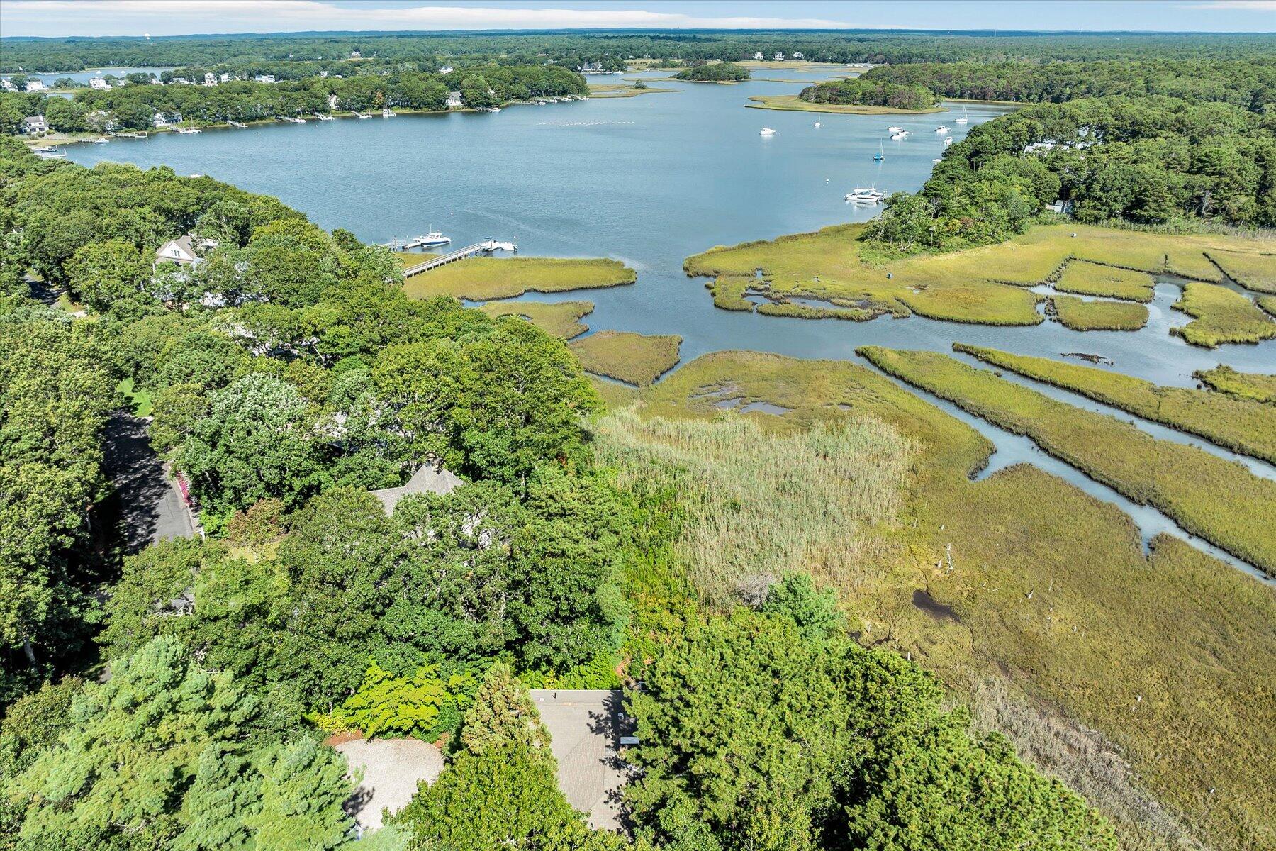 5 Tide Run Mashpee, MA 02649 - Photo 9 of 64 an aerial view of a house with outdoor space and lake view