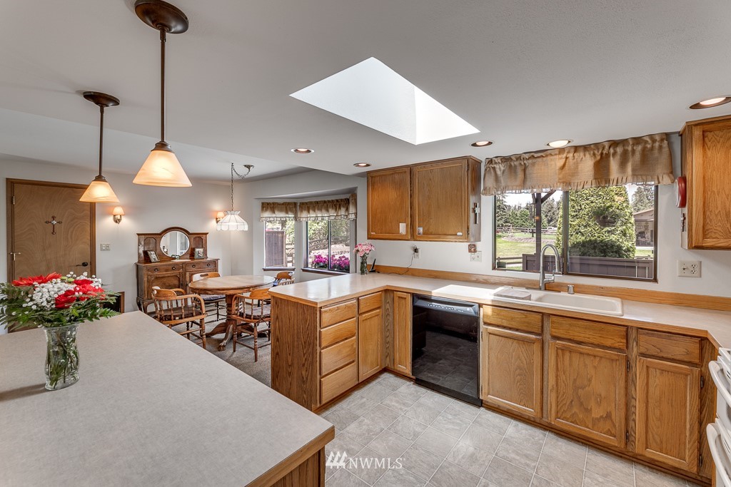 4903 169th Street Southeast Bothell, WA 98012 - Photo 14 of 32 a kitchen with lots of counter top space