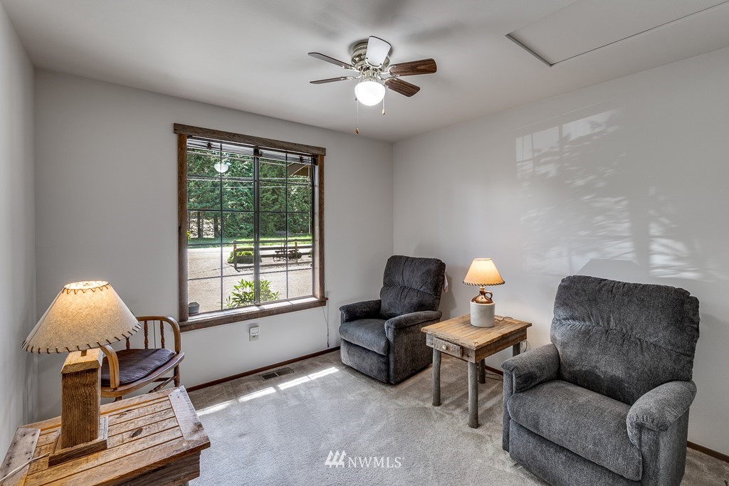 4903 169th Street Southeast Bothell, WA 98012 - Photo 19 of 32 a living room with furniture and a window