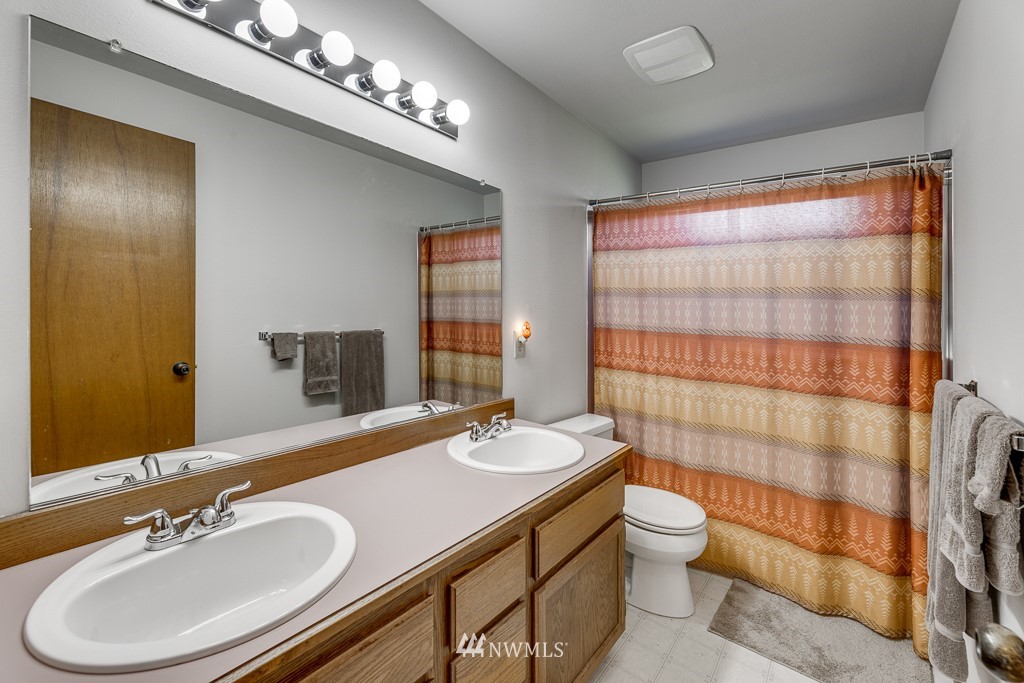 4903 169th Street Southeast Bothell, WA 98012 - Photo 20 of 32 a bathroom with a sink double vanity and toilet