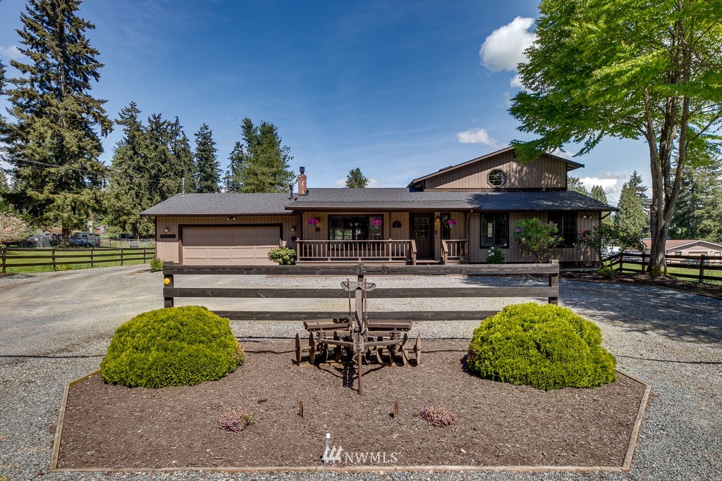 4903 169th Street Southeast Bothell, WA 98012 - Photo 2 of 32 a view of a house with backyard and sitting area