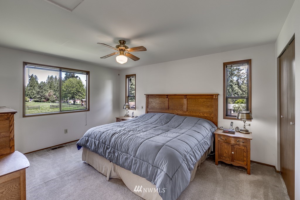 4903 169th Street Southeast Bothell, WA 98012 - Photo 21 of 32 a bedroom with a bed and a window