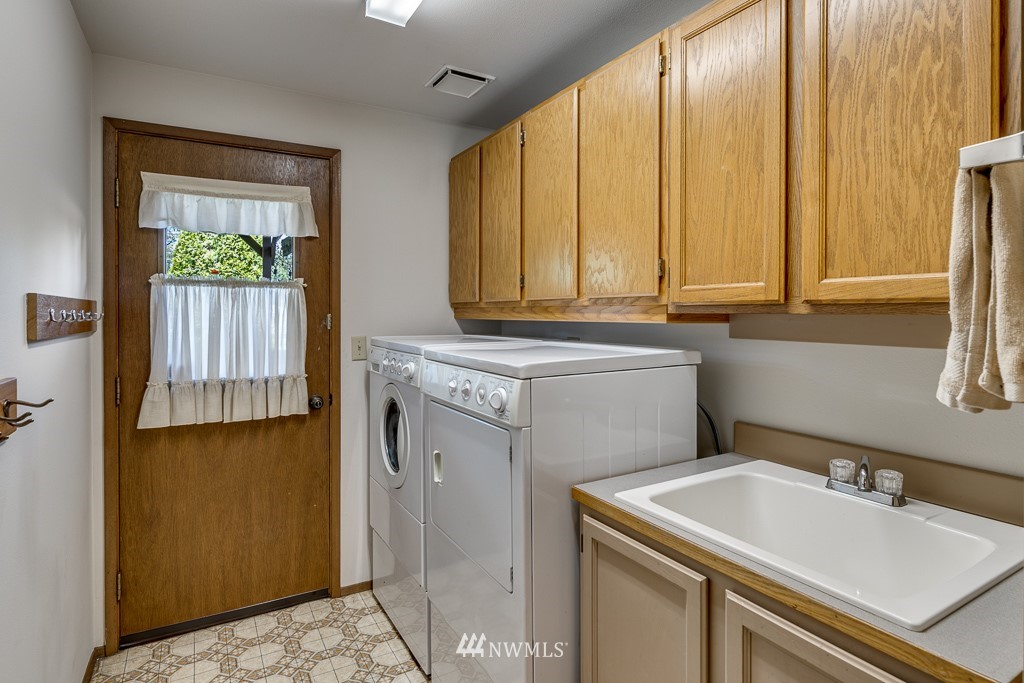 4903 169th Street Southeast Bothell, WA 98012 - Photo 24 of 32 a utility room with a sink washer and dryer