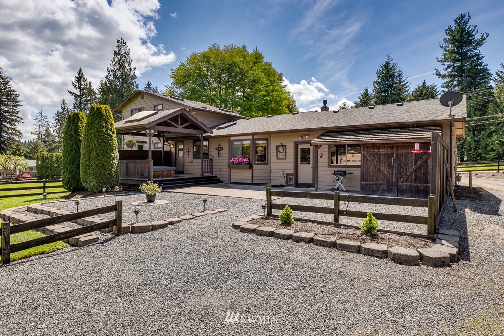 4903 169th Street Southeast Bothell, WA 98012 - Photo 25 of 32 a view of backyard with a table and chairs