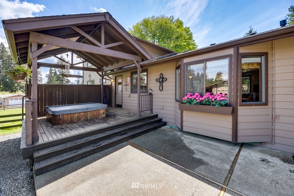4903 169th Street Southeast Bothell, WA 98012 - Photo 26 of 32 a front view of a house with a garden