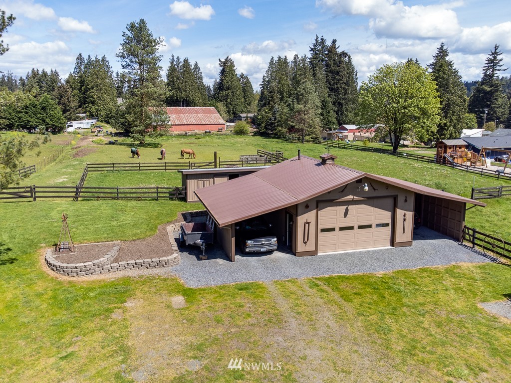 4903 169th Street Southeast Bothell, WA 98012 - Photo 6 of 32 an aerial view of a house with a yard table and chairs