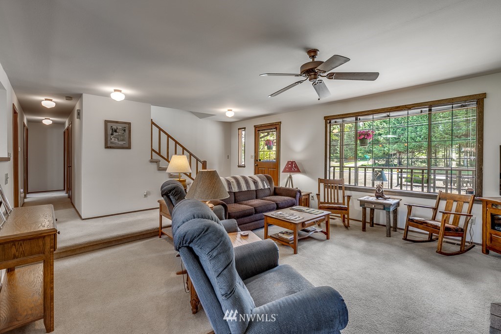 4903 169th Street Southeast Bothell, WA 98012 - Photo 10 of 32 a living room with furniture and a large window