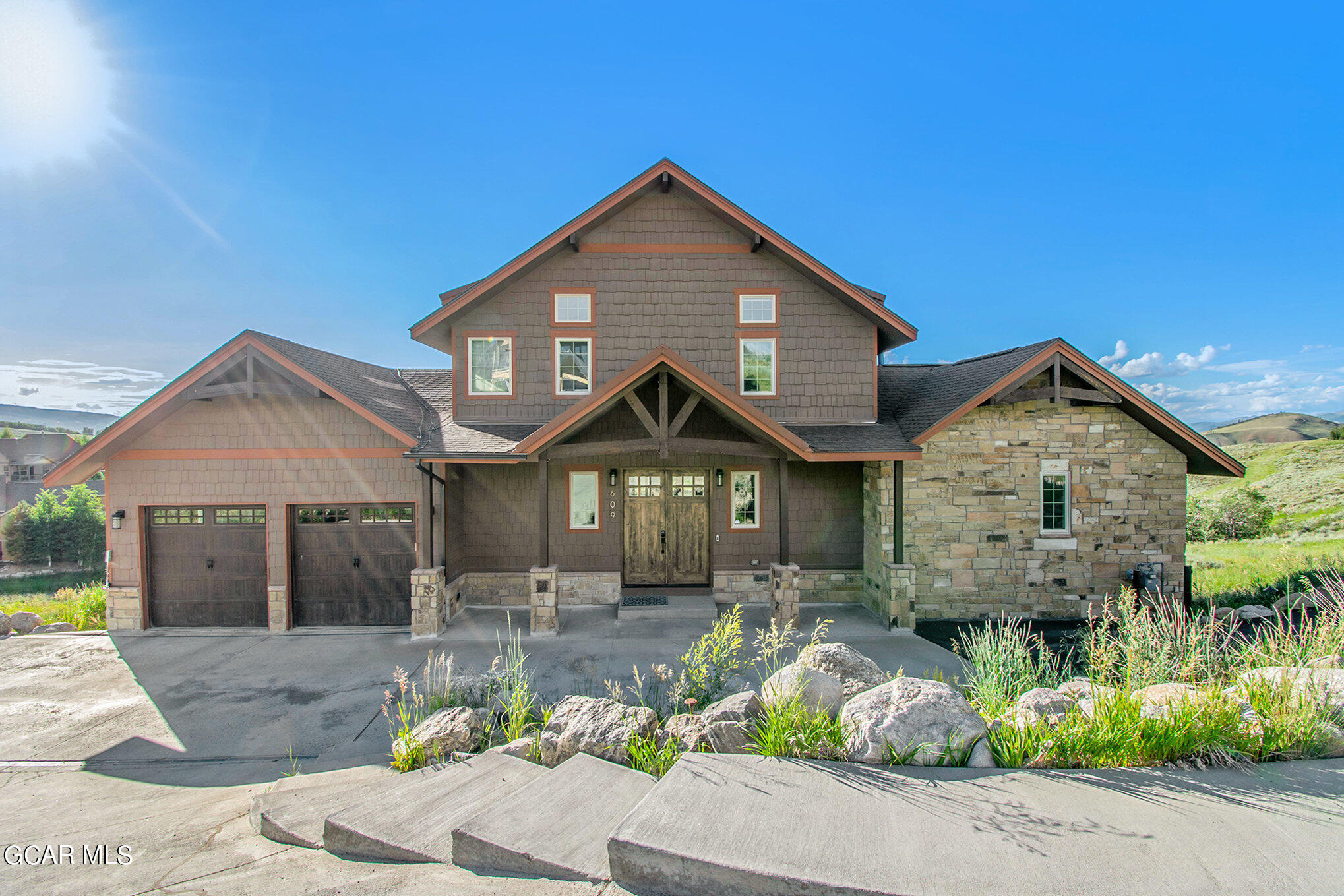 609 Lower Ranch View Drive Granby, CO 80446 - Photo 11 of 54 a front view of a house with a garden