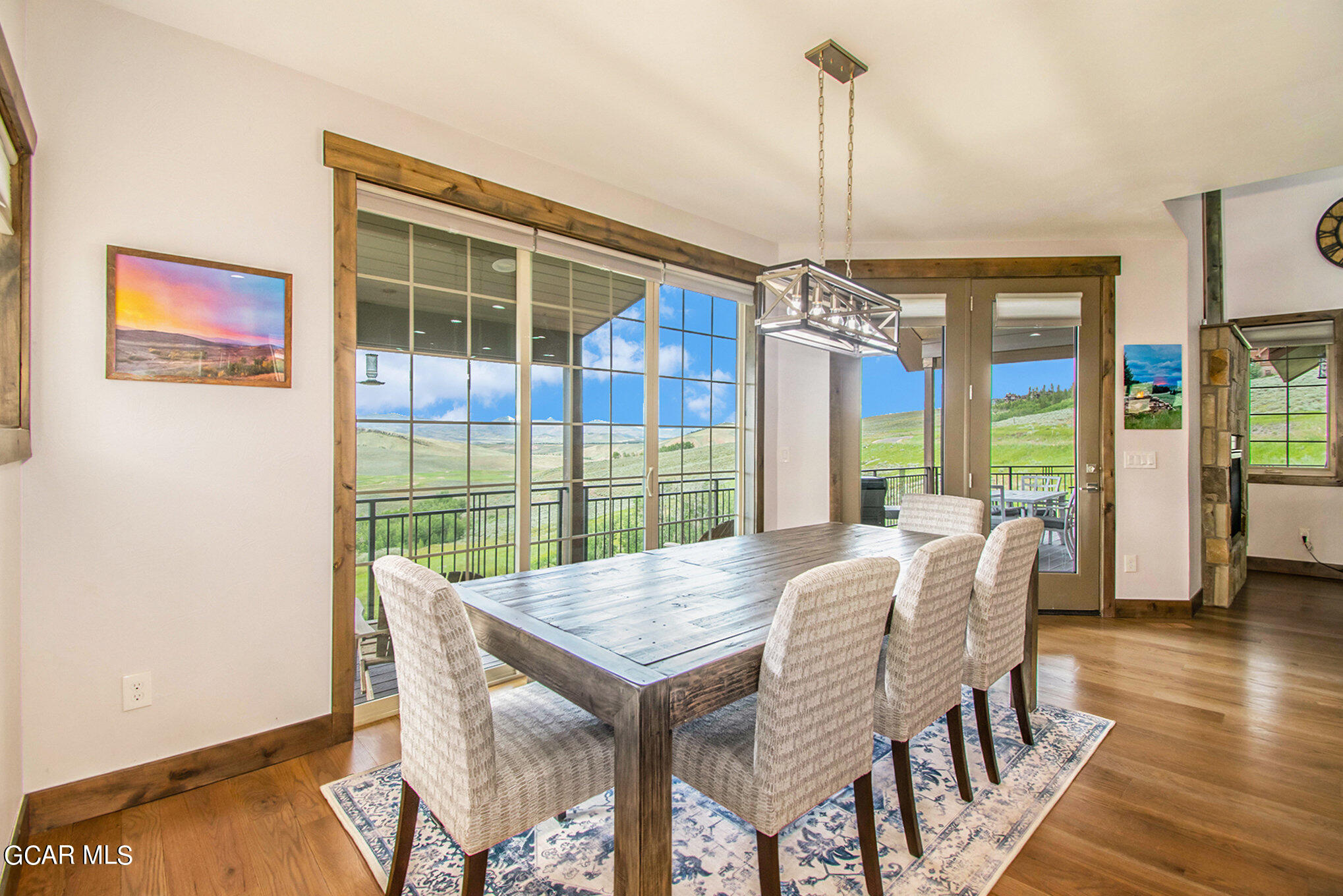 609 Lower Ranch View Drive Granby, CO 80446 - Photo 19 of 54 a view of a dining room with furniture window and wooden floor