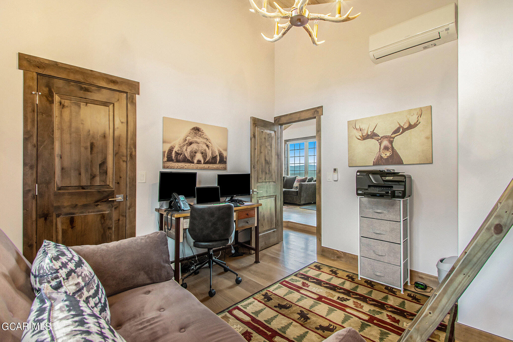 609 Lower Ranch View Drive Granby, CO 80446 - Photo 26 of 54 a living room with furniture and a chandelier
