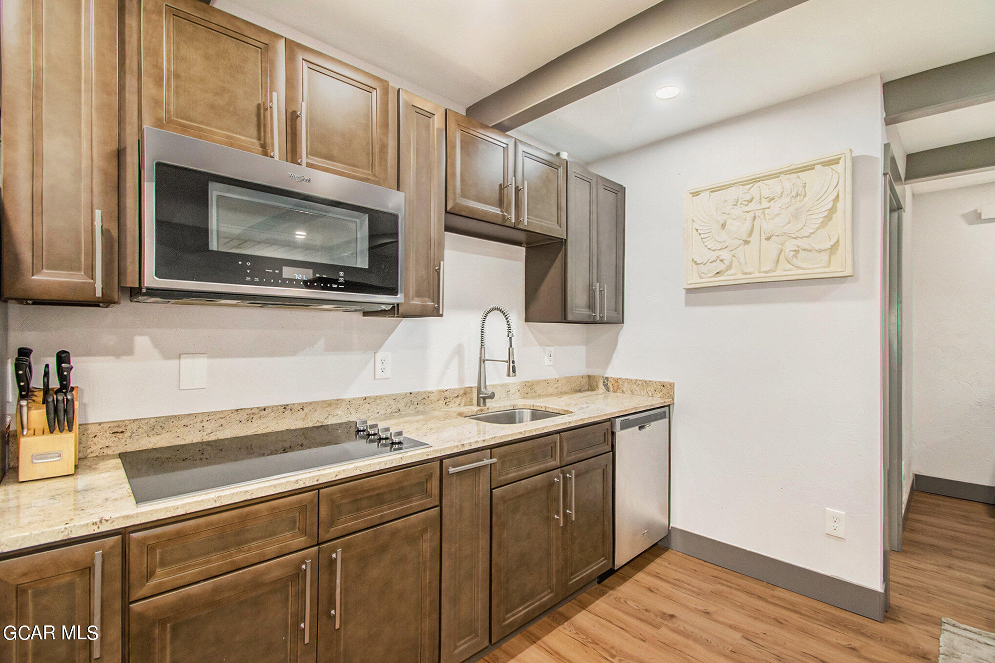 609 Lower Ranch View Drive Granby, CO 80446 - Photo 38 of 54 a kitchen with stainless steel appliances granite countertop a sink and a microwave