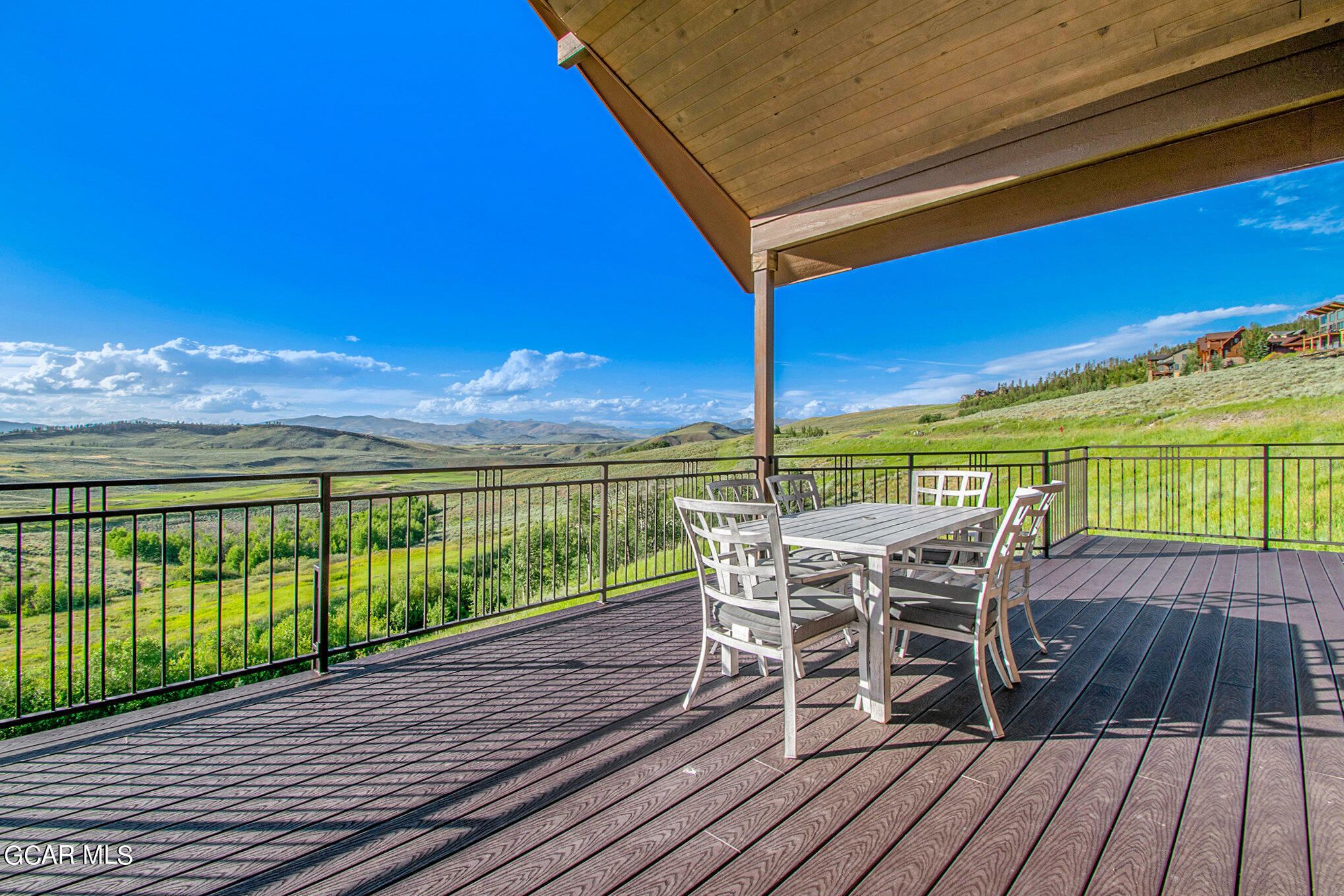 609 Lower Ranch View Drive Granby, CO 80446 - Photo 41 of 54 a view of a balcony with furniture and wooden floor