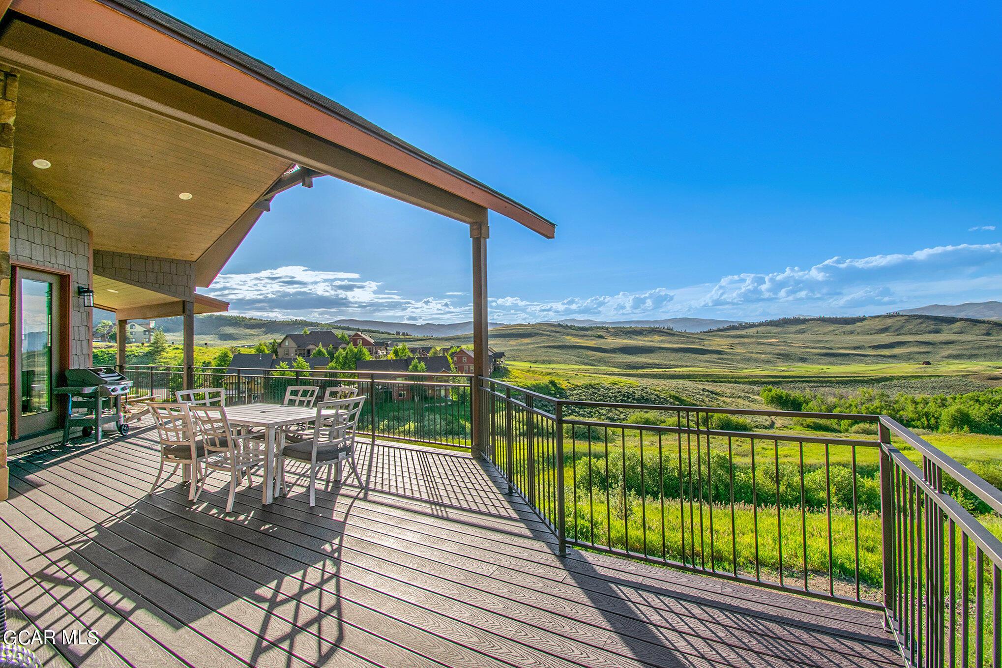 609 Lower Ranch View Drive Granby, CO 80446 - Photo 42 of 54 a view of a balcony with dining table & chairs