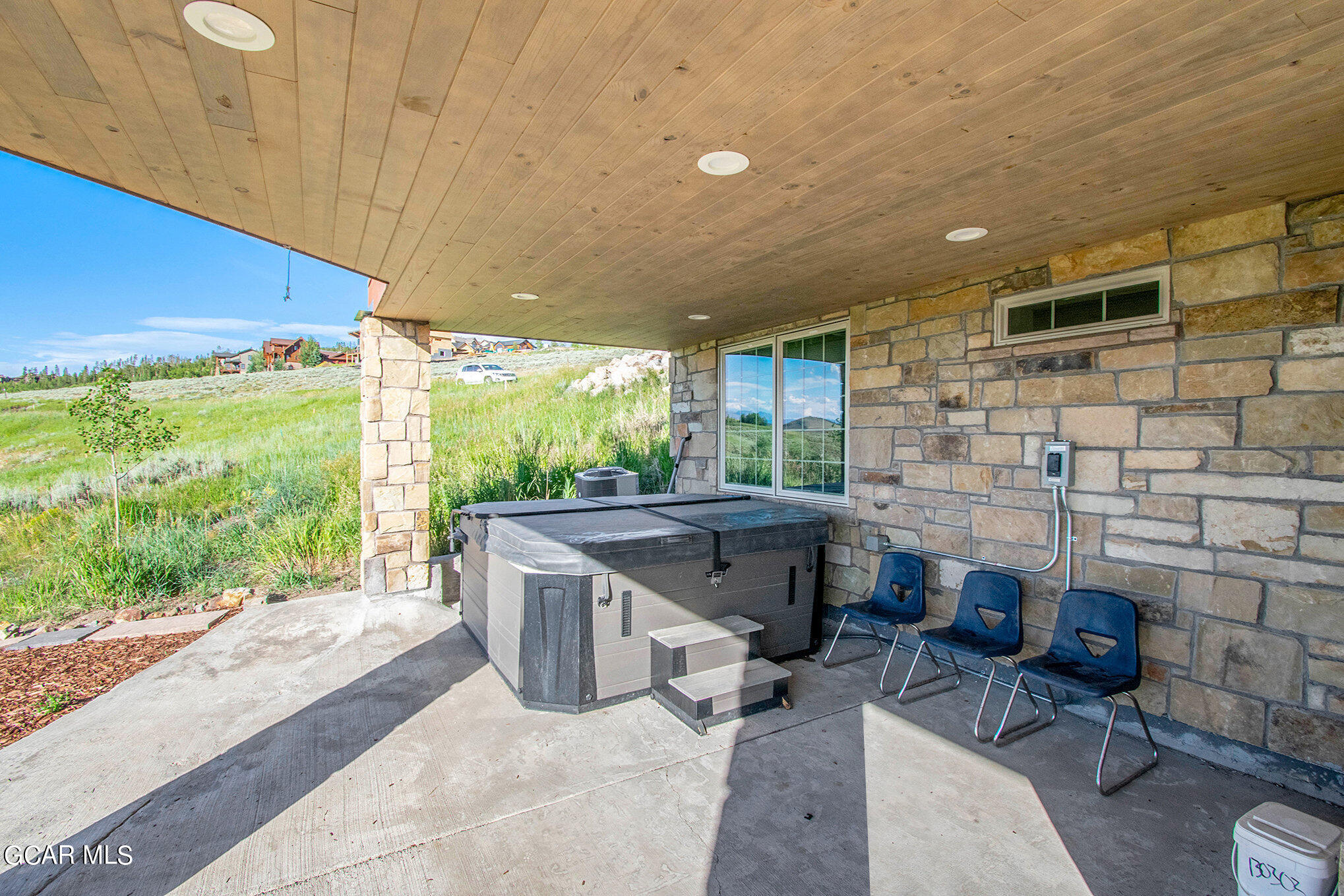 609 Lower Ranch View Drive Granby, CO 80446 - Photo 45 of 54 a patio with table and chairs
